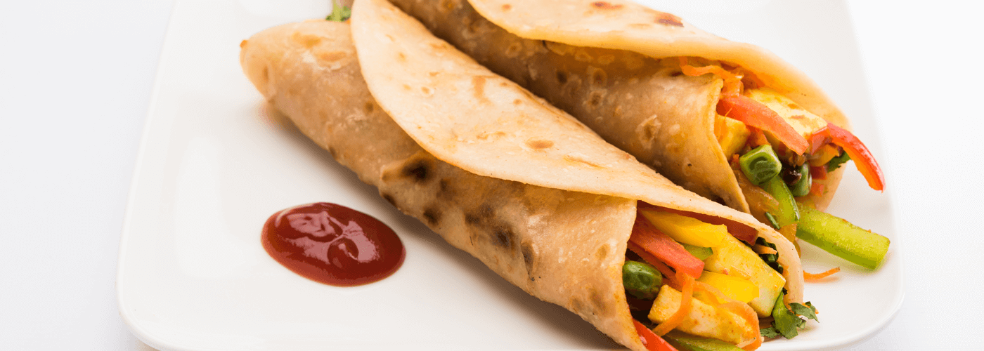 Vegetables wrapped in chapati and served with sauce