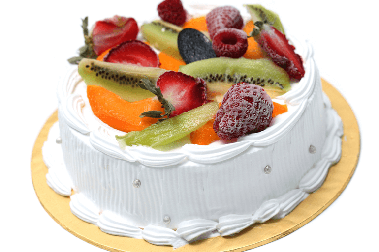 Cake covered with whipping cream and topped with fruits