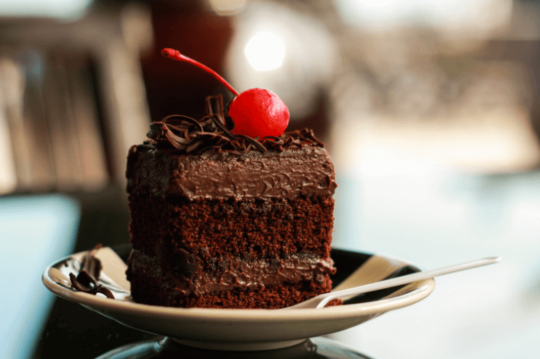 Delux chocolate cake with cherry on top