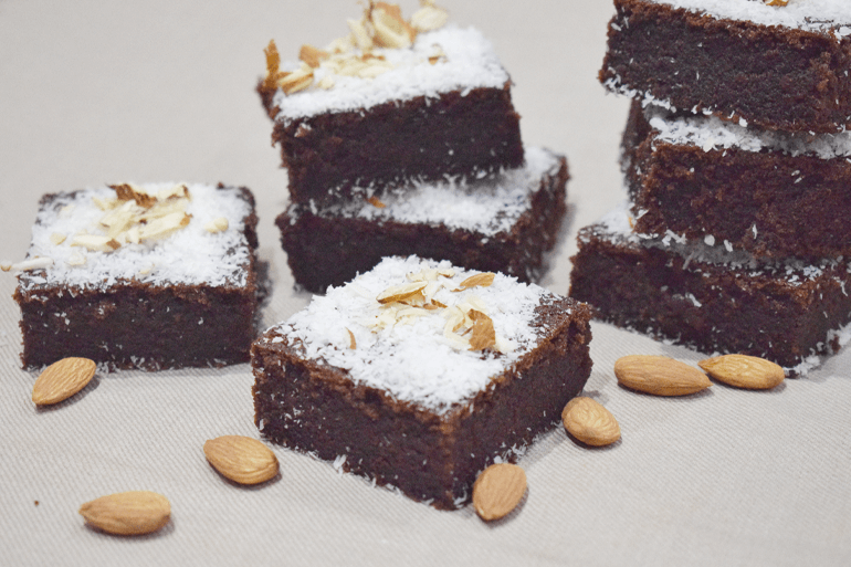 Coconut Almond caked pieces garnish with desiccated coconut and whole almonds