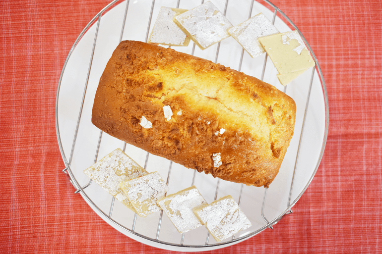 Kaju Katli Loaf Cake served with kaju Katli on Plates