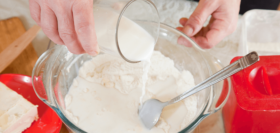 adding milk for baking