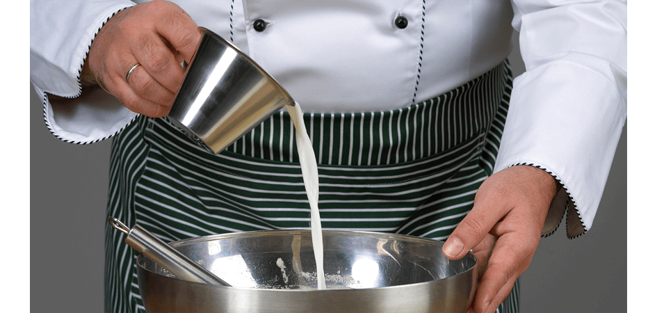 chef adding milk